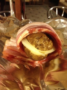 My favorite! Onion Stuffed potatoes wrapped in bacon!